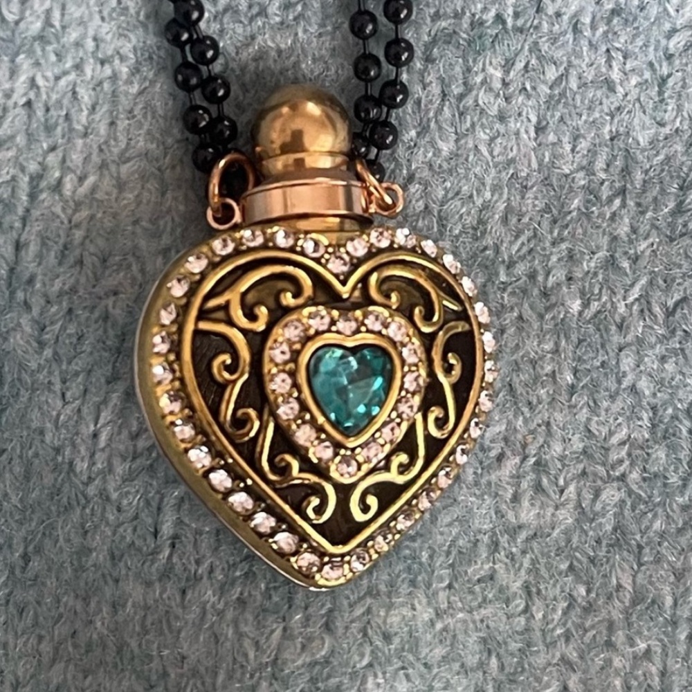 Pendant Necklace is s perfume bottle